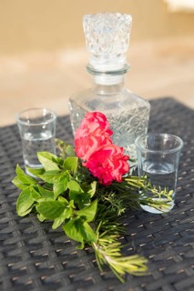 Red hibiscus flower, Greek herbs and raki, Crete, Greece
