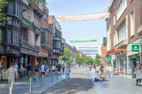 Shoppers in pedestrianised High Street in city centre of Exeter, Devon, England, UK
