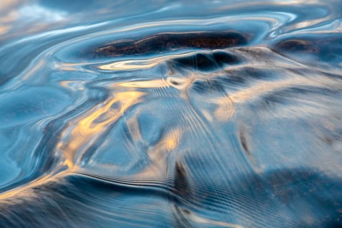 Waves in a stream, abstract, Norrbotten, Lapland, Sweden, August 2022