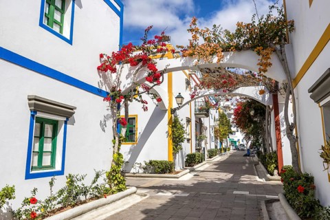 Puerto de Mogan typical colorful houses with flowers on Gran Canaria island vacation trip in Puerto