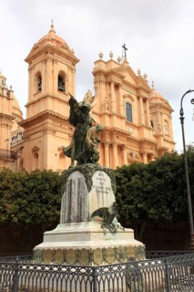 Sicily, war memorial and the Basilica of San Nicolo in the old town of the late Baroque town of