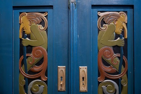 Blue-painted cabinet with incorporated relief depictions of trolls in Art Nouveau style, Museum