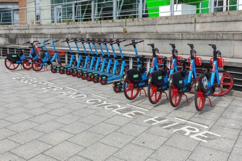 Public rental electric vehicles WEST e-bikes and e-scooters operated by micromobility company Dott,