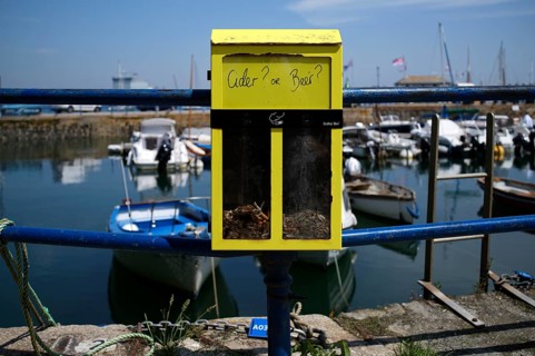 Ashtray as a ballot box, for cigarette butts, for voting, are cider or beer, Falmouth, Cornwall,