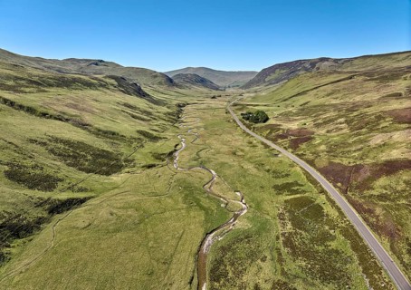 Aerial drone view of the highland landscape in the Cairn Gorm National Park, Scotland, UK