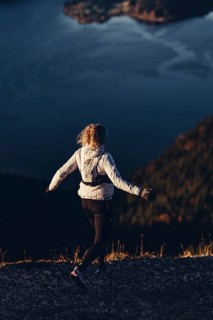 Trail running in autumn on the Jochberg on Lake Walchensee against the wonderful backdrop of the