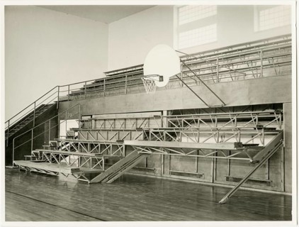 Basketball hall, modern seats, 1920s design, modern, empty stand with basketball hoop in a sports