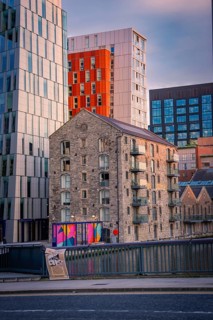 A mix of old and modern buildings in an urban landscape at dusk, Docklands Dublin, Ireland