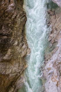 The Lammer creek is flowing fast through the Lammerklamm on a sunny hiking day