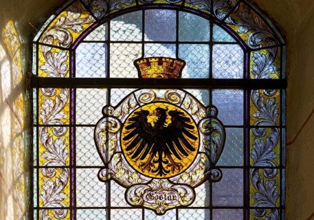 Stained glass window with the city coat of arms in the market church of St Cosmas and Damian,