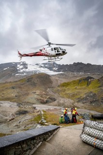 Air rescue operations in the mountains, rescue helicopter, Valais, Switzerland
