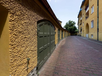 Yellow residential buildings, garages, borstei, heritage-protected residential development, Munich,