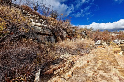 View of overgrown rocks in a dry, barren landscape, the thornshrub savanna in the Caatinga