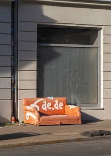 Garbage parked on public roads, couch in orange, Neue Schönholzer Straße, Berlin, Germany