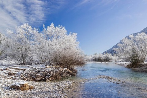 Isar valley in winter at temperatures of minus 18 degrees Celsius. Snow covered landscape with the
