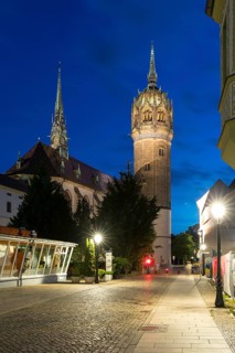 Atmospheric night view, Schlossplatz with castle church and castle church tower, Luther city
