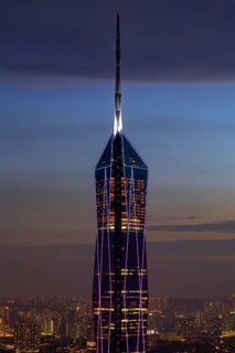 Merdeka 118, Merdeka Tower, neo-futuristic megatall skyscraper illuminated at dusk in capital city