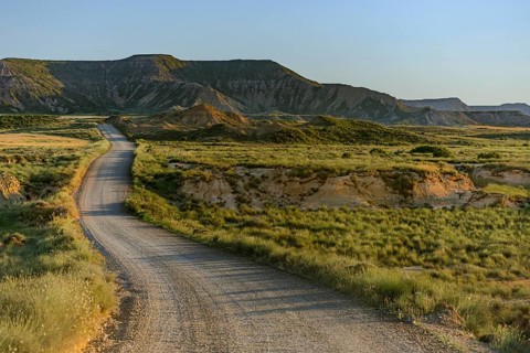 Gravel road through Bardenas Reales Natural Park, Navarra, Spain