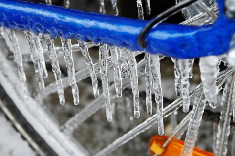 Bicycle icy due to freezing rain, icicles, detailed view