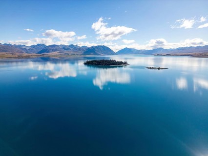 Aerial view of Lake Tekapo in Canterbury, New Zealand, showcasing a breathtaking turquoise lake