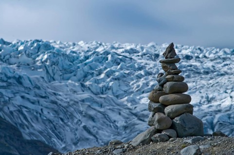 Stone men in front of the Skaftafell glacier in Iceland
