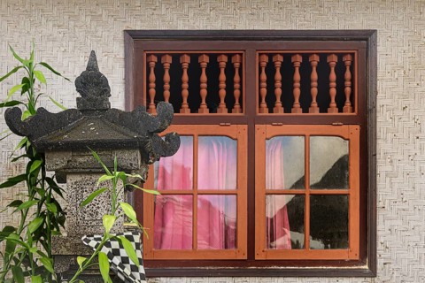 Window in traditional Balinese woven bamboo house with altar, Penglipuran Village, Bangli Regency,