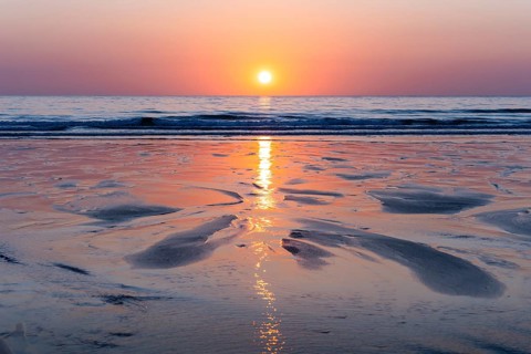 Sunset by the sea at Gwithian Beach. Gwithian, Hayle, Cornwall, England, Great Britain