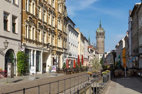 Castle Street with Castle Church Tower and Röhrwasser, Luther city Wittenberg, Saxony-Anhalt,