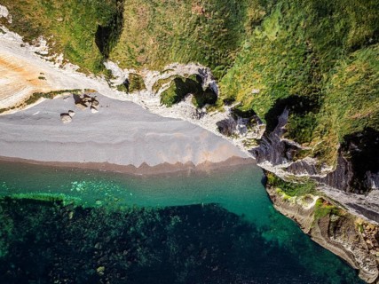 Aerial view, top-down view of the rugged, distinctive cliffs, chalk cliffs, pebble beach in the