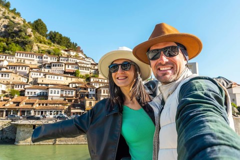 Portrait Joyful heterosexual couple looking at camera taking selfie photo laughing enjoying spring