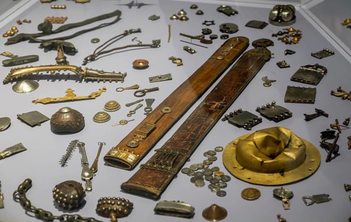 Various ancient Roman metal utensils, coins, buckles, sword sheath, Varus Battle Roman Museum