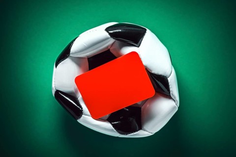 Platter soccer with red card, symbolic photo Balogun scandal of the 2026 soccer World Cup,