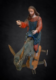 Christ on the palm donkey, on a dark background, wooden figure from around 1400, Museum Bezau,