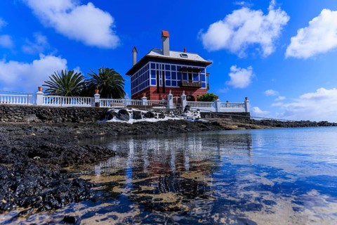 Lanzarote, Canary Islands, Spain, Europe, Arrieta Blue House, A house at the water's edge with its