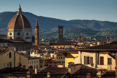Cathedral dome, tower of Palazzo Vecchio, view over the rooftops, old town, warm evening light,