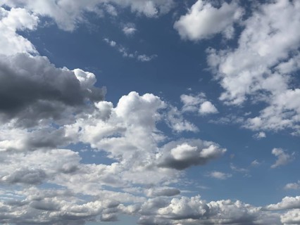 White and gray clouds driven by approaching storm large Cumulus Stratocumulus cluster clouds