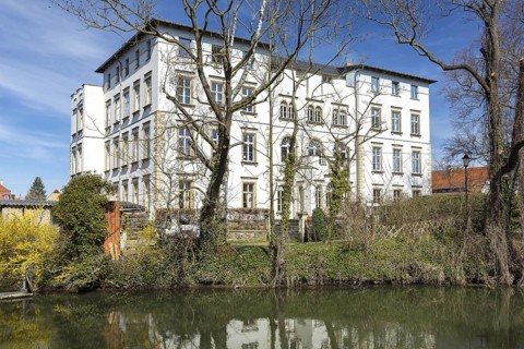 Park view of Lützschena Castle with White Elster, Leipzig, Saxony, Germany