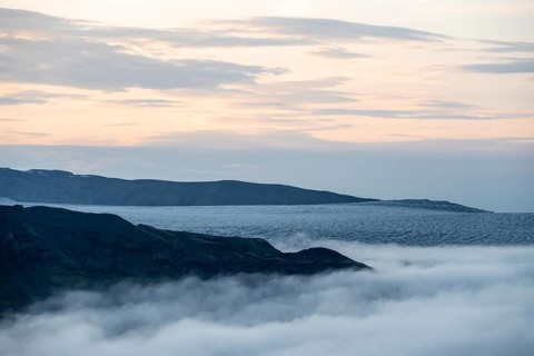 Fog over the glacier ice of Myrdalsjökull glacier, at sunset, Pakgil, Iceland