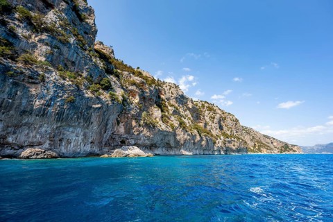 Picturesque rocky coast, cliffs and blue sea, Golfo di Orosei, Baunei, Sardinia, Italy