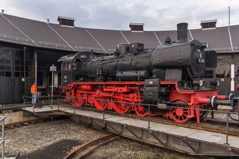 Passenger locomotive 38 2383 built in 1918 is pushed by a shunting locomotive onto the threshing