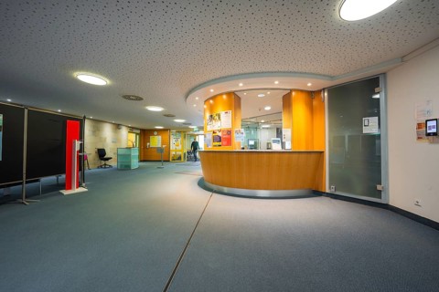 Modern reception with wooden paneling and glass details, Nagold Hospital of the Southwest Clinic