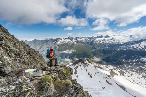 Mountaineer at the Schönbichler Scharte, view of mountain landscape with snow and glacier, mountain