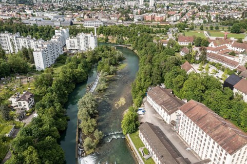 Apartment block and commercial buildings at the Limmat river, Wettingen peninsula, aerial view,