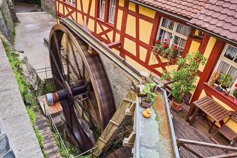 Schlossmühle, watermill, historic water wheel, old town, half-timbered house, motion blur, elevated