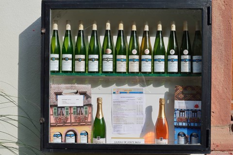 Showcase with wine bottles, Eguisheim, Haut-Rhin, Alsace, Grand Est, France