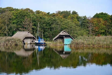 Thatched boat houses at Prerow harbour, Fischland-Darß-Zingst, Mecklenburg-Western Pomerania,