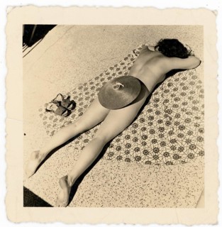 Bathing, swimwear, sunbathing, summer, woman lying on the ground and basking on a patterned