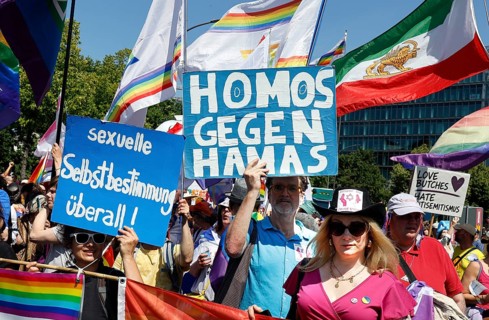 Homos say yes to Israel and homos against Hamas are on posters during the CSD Pride demo under the