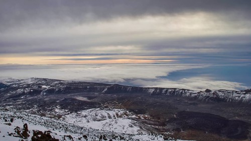From Pico del Teide, Teide summit, panoramic views over snow-covered mountains and underlying