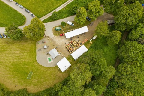 Detailed view of a garden party with tents and people in nature, Father's Day, forest festival,